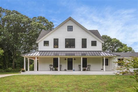 White Modern Farmhouse With James Hardie Fiber Cement Siding And Mira