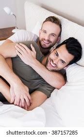 Happy Gay Couple Lying On Bed Foto Stock Shutterstock