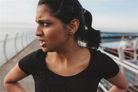 Young East Indian Woman Tired And Breathing After Hard Run Workout