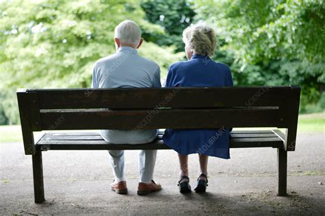 Older Couple Sitting On A Park Bench Chatting Stock Image C0465018 Science Photo Library