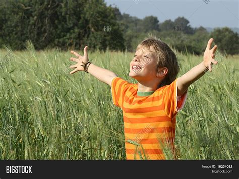 Happy Christian Child Arms Raised Image And Photo Bigstock