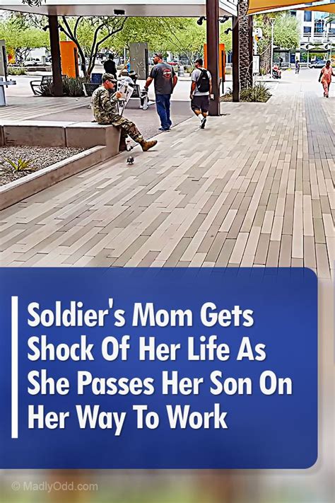 a blue sign that says soldier s mom gets shock of her life as she passes her son on her way to work