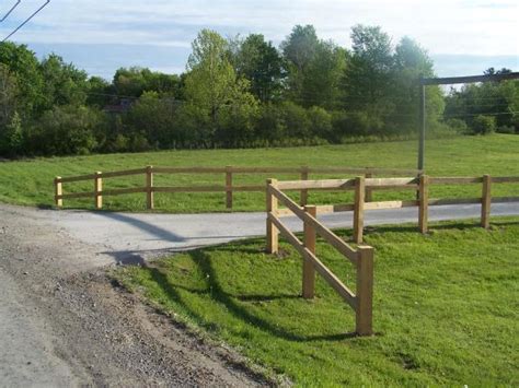 In addition to the looks and the ancient feel, the wood split rail fences have several advantages Traditional Driveway in Middlebury - garden, light wood ...