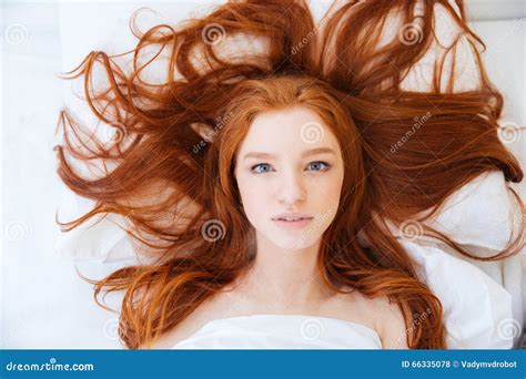 Woman With Beautiful Long Red Hair Lying In Bed Stock Photo Image