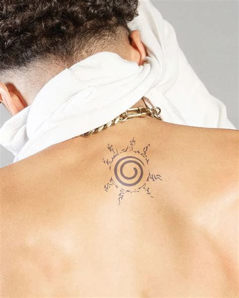 A Man With A Tattoo On His Back