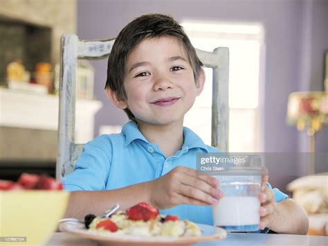 Young Boy Eating Breakfast Stock Photo Getty Images