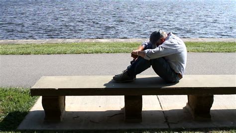 A Sad Man Sits Alone On A Park Bench Stock Footage Video 3959062