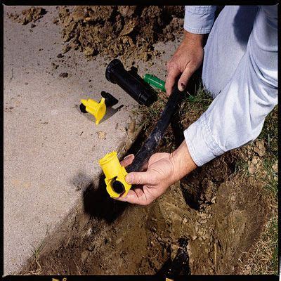 Connect the pipes and lay them into the trenches. How to Install Your Own Underground Sprinkler System ...