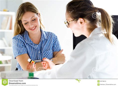 Female Doctor Prescribing Medication For Patient Stock Image Image