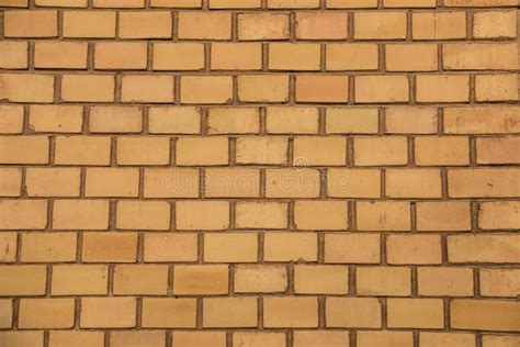 Old Empty Brick House Factory Wall With Yellow Bricks Stock Image