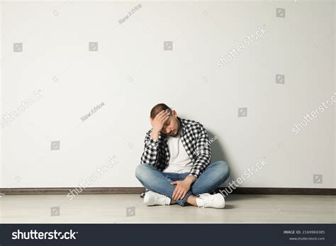 Sad Young Man Sitting On Floor Stock Photo 2169969385 Shutterstock