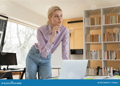 Pensive Young Female Blonde Employee Considering Problem Solution