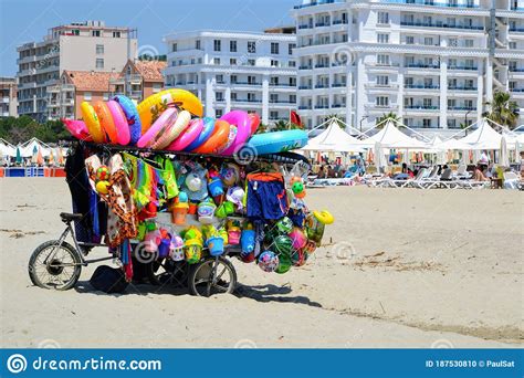 Toys Seller Cart With Plastic Toys And Beach Balls On The Sandy Beach