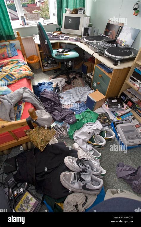 Boys Bedroom In A Very Messy Condition With Cloths And Rubbish Strewn