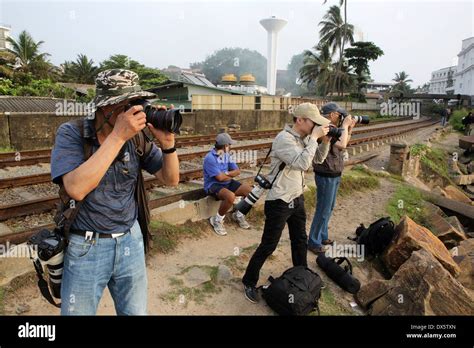 Chinese Tourists On Photography Tour Of Sri Lanka Taking Photos In