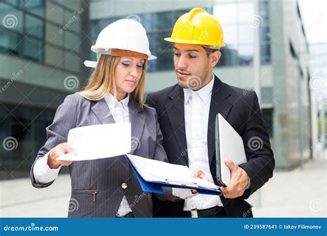 Smiling Engineer And Woman Designer Are Estimating Results Of Their