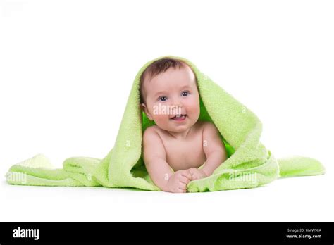 Newborn Baby Lying Down And Smiling In A Green Towel Stock Photo Alamy
