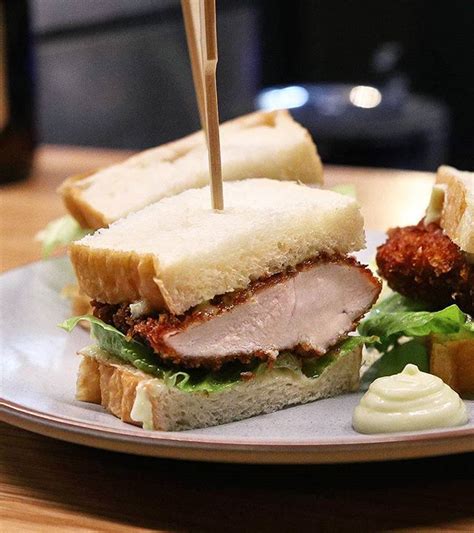 You'll love the crispy chicken paired with the tangy tonkatsu sauce and crunchy cabbage slaw. Plump and tender chicken katsu sando @torissongmelbourne ...