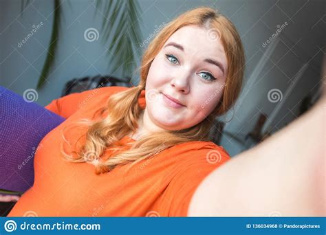 Chubby Woman Sport At Home Standing With Mat Taking Selfie Photos
