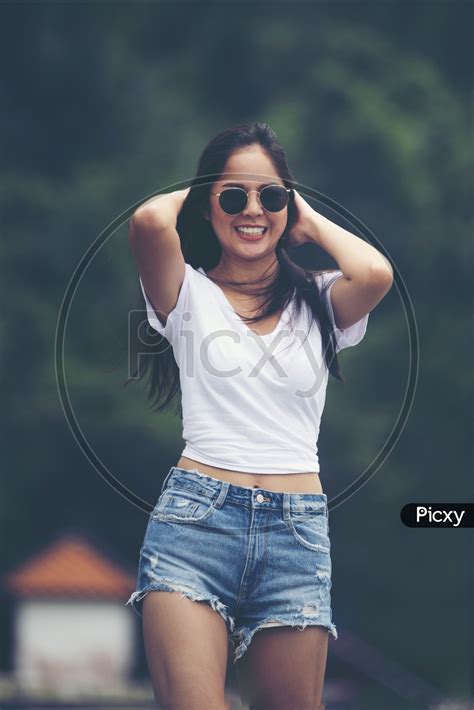 Image Of Sexy Asian Girl Walking In Nature Filed Ek221542 Picxy