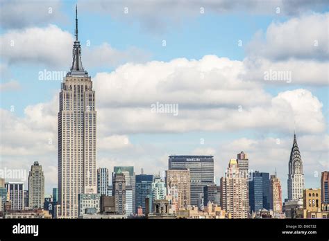Skyline Of New York City Prominently Featuring The Empire State