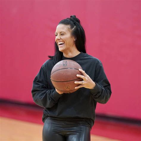 USWNT's Ali Krieger prepares to shoot for a basket on a visit with the Houston Rockets February ...