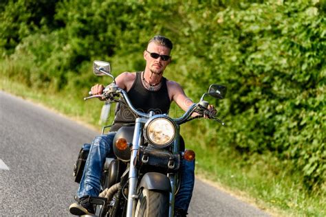 Tough Guy On Chopper Bike In Motion On The Road Stock Photo Image Of