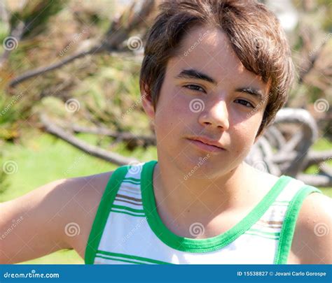 A Teenage Caucasian Boy Sits On Yellow Penny Picture Isolated On White