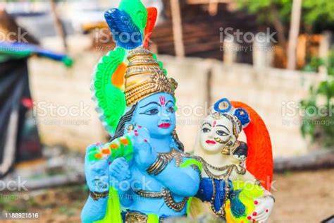 Colorful Plaster Of Paris Statue Of Lord Krishna Playing Flute And
