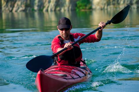 Man Kayaking In Beautiful Scenery Paddle Pursuits