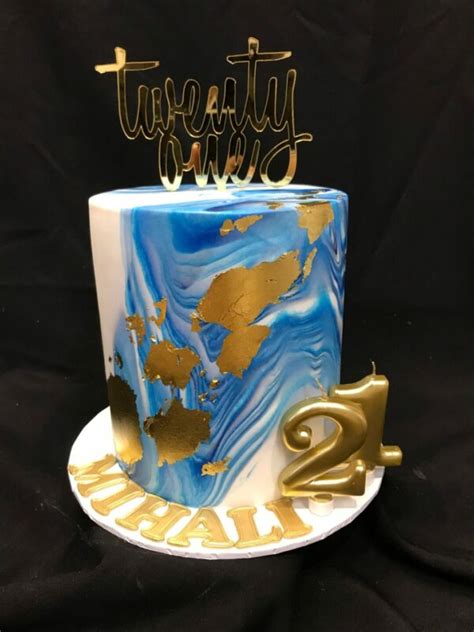 Blue Marbled Icing With Gold Leaf And Topper Heidelberg Cakes