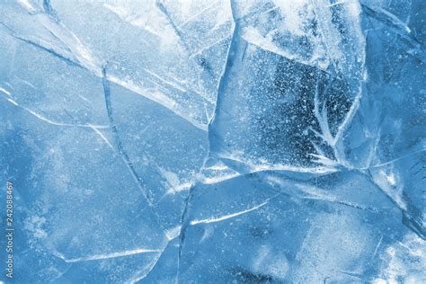 Abstract Ice Background Blue Background With Cracks On The Ice Surface