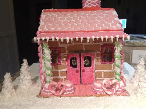 Pink Gingerbread House Made Out Of Graham Crackers Holiday
