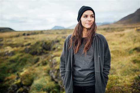 Beautiful Icelandic Female Standing Between The Mossy Ground In Iceland