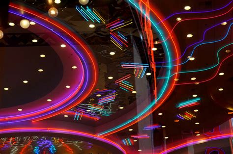 Clear acrylic ceiling fan with bright pink neon. Neon, Palms and Ocean Views | Mirror80