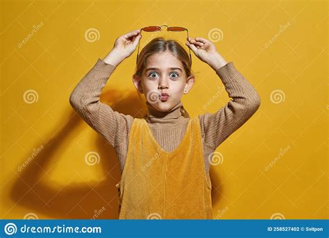 Surprised Little Girl Holding Glasses Over Head Stock Photo Image Of