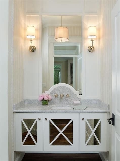 While bathroom vanity cabinets can be relatively expensive to buy, they're not at all difficult to build. Glam powder room boasts a floating vanity fitted with ...