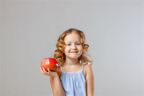 Happy Little Girl Child Holding A Red Apple Healthy Food