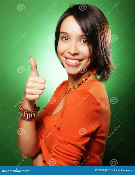 Smiling Beautiful Young Woman Showing Thumbs Up Gesture Stock Photo