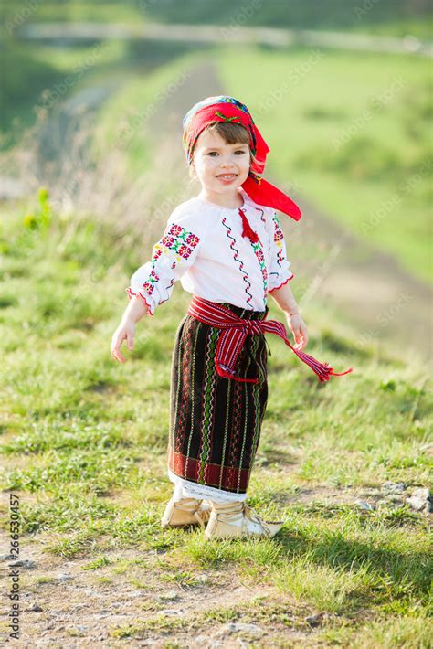 Little Girl In Traditional Romanian Folk Costume With Embroidery Girl