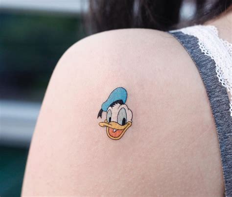 Donald Duck Tattoo By Tattooist Saegeem Tattoogrid Net
