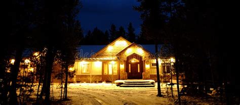 Night Time Cabin In The Woods Wilderness Lights Glowing Warmth Stock