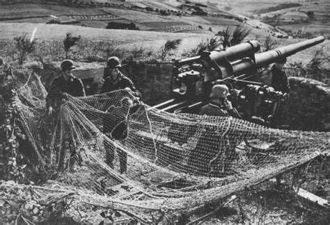 World War Ii History Soldiers Pull Camouflage Net On The Position Of