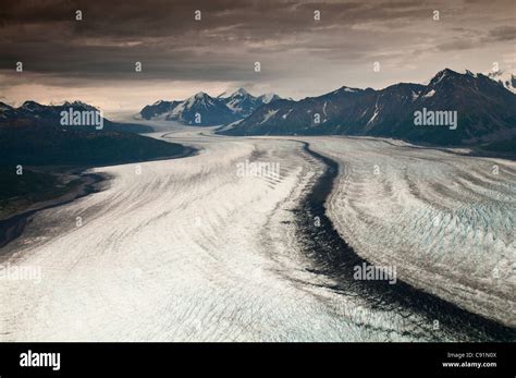 Aerial View Of Knik Glacier Under The Dark Clouds Of A Summer Rain