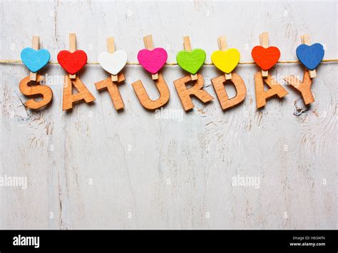 Saturday Word From Wooden Letters With Colored Clothespins On A White