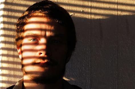 Man Face Window Stripes Shadow Effect Daytime Window Stripes