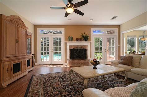 It is where our guests are seated when we are getting ready to meet them. Living room - french doors with fireplace between ...