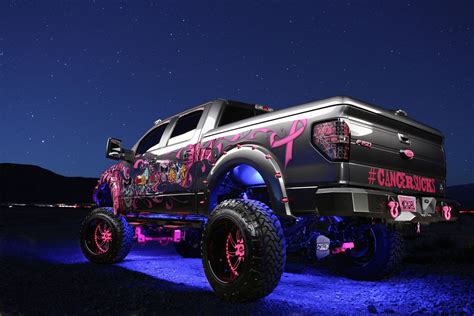 F150 With A Massive Lift And Crazy Pink Graphics Custom Trucks Ford