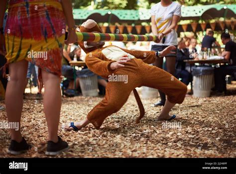 Monkeying Around A Guy Dressed In A Monkey Costume Doing The Limbo