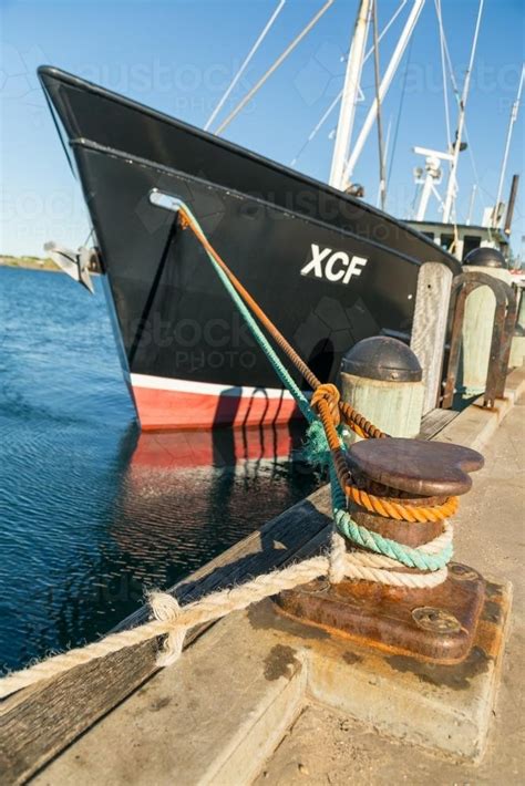 Image Of A Fishing Boat Tied Up To A Wharf Austockphoto